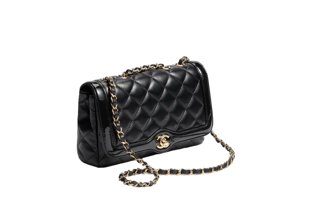 A black Chanel handbag with a gold chain