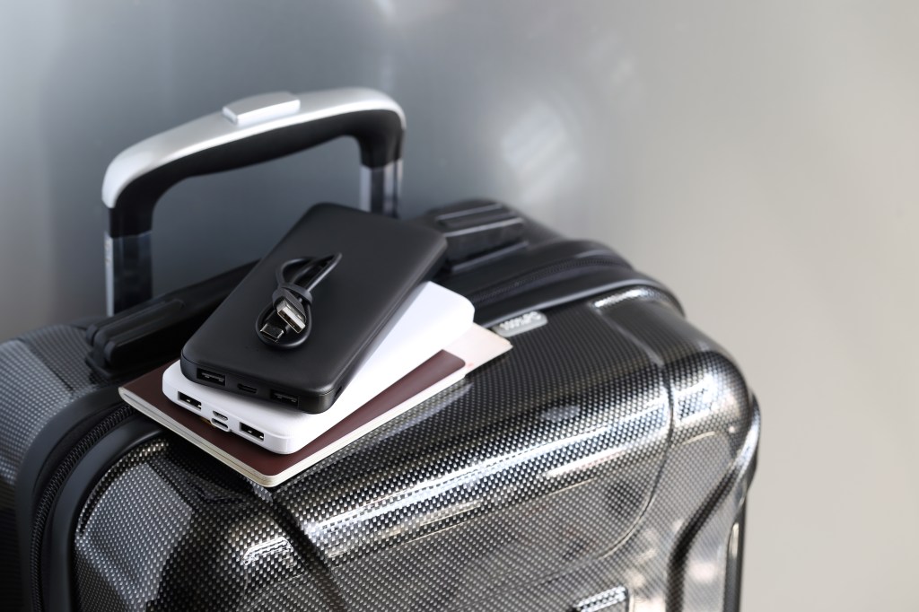 Power bank and passport in luggage for holiday travel